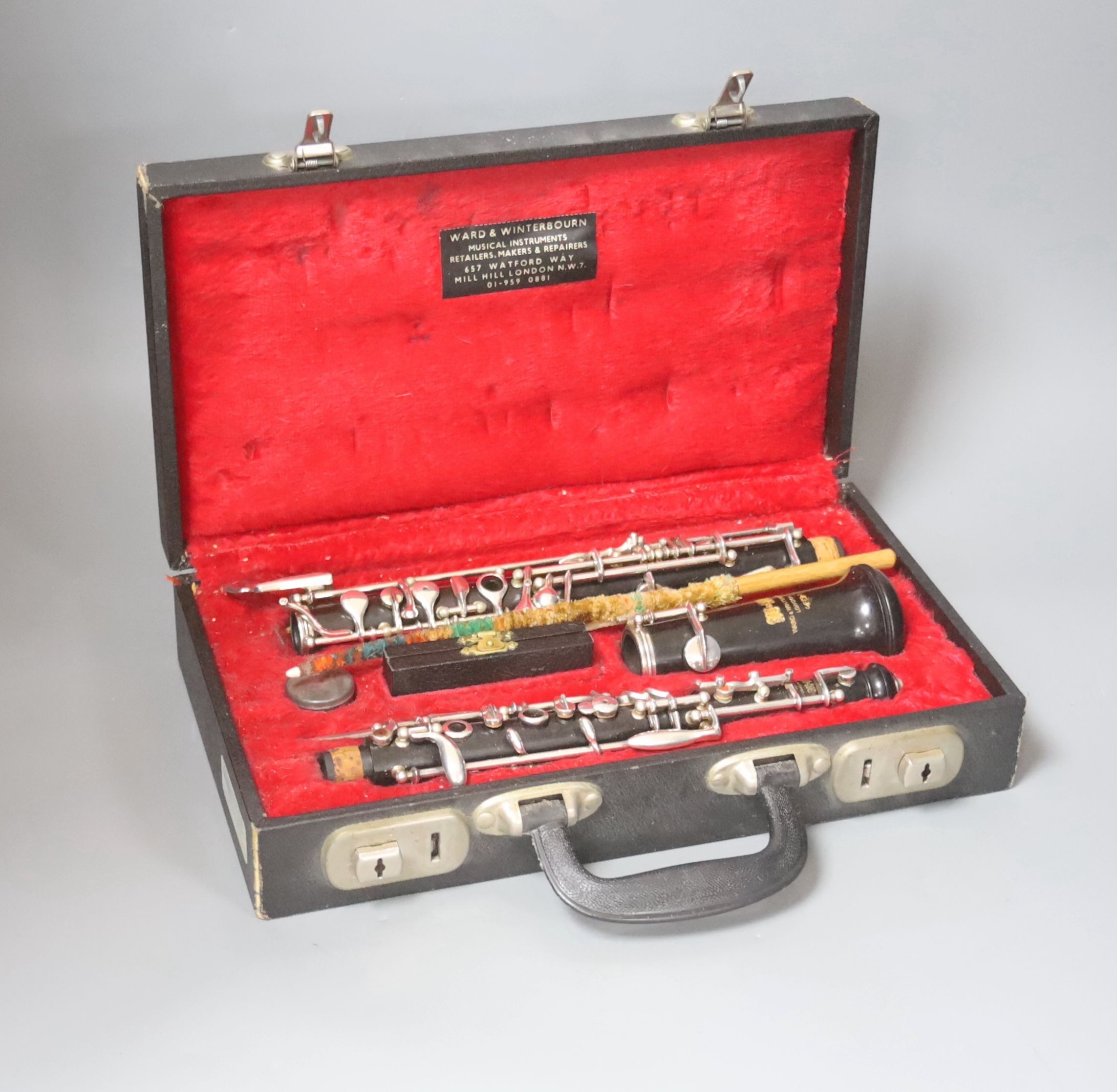 A Ward & Winterbourne ebony oboe in fitted case.